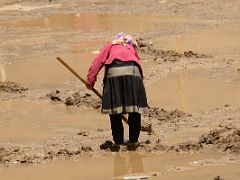 16 Woman Tilling A Wet Field In Yilik Village On The Way To K2 China Trek